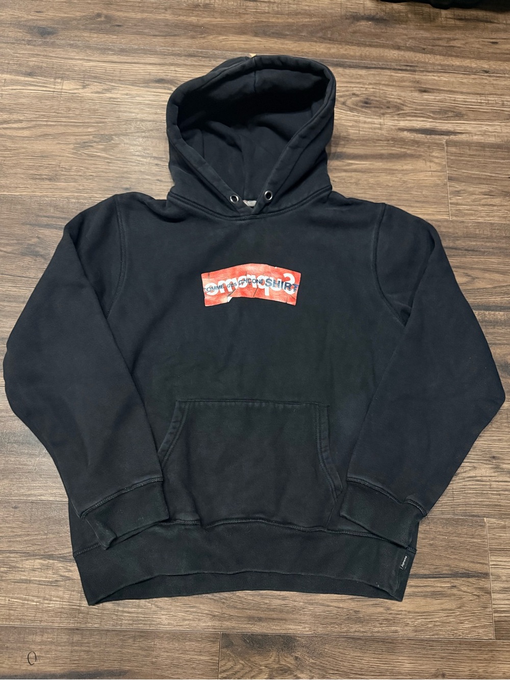 Supreme x Comme des Garcons Black Hoodie with Red Chest Patch